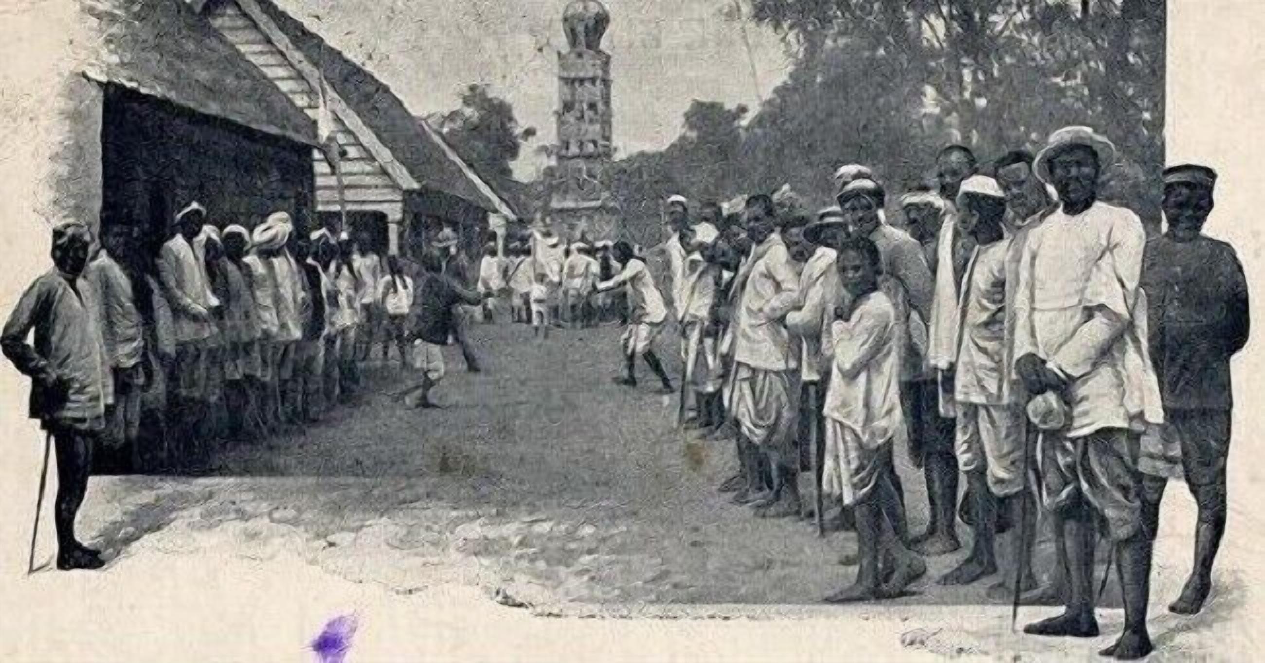 A historical scene with people in traditional attire, a building with a staircase, and a tower in the background.