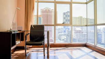 Ramada Suite | Living area | 32-inch flat-screen TV with cable channels, TV