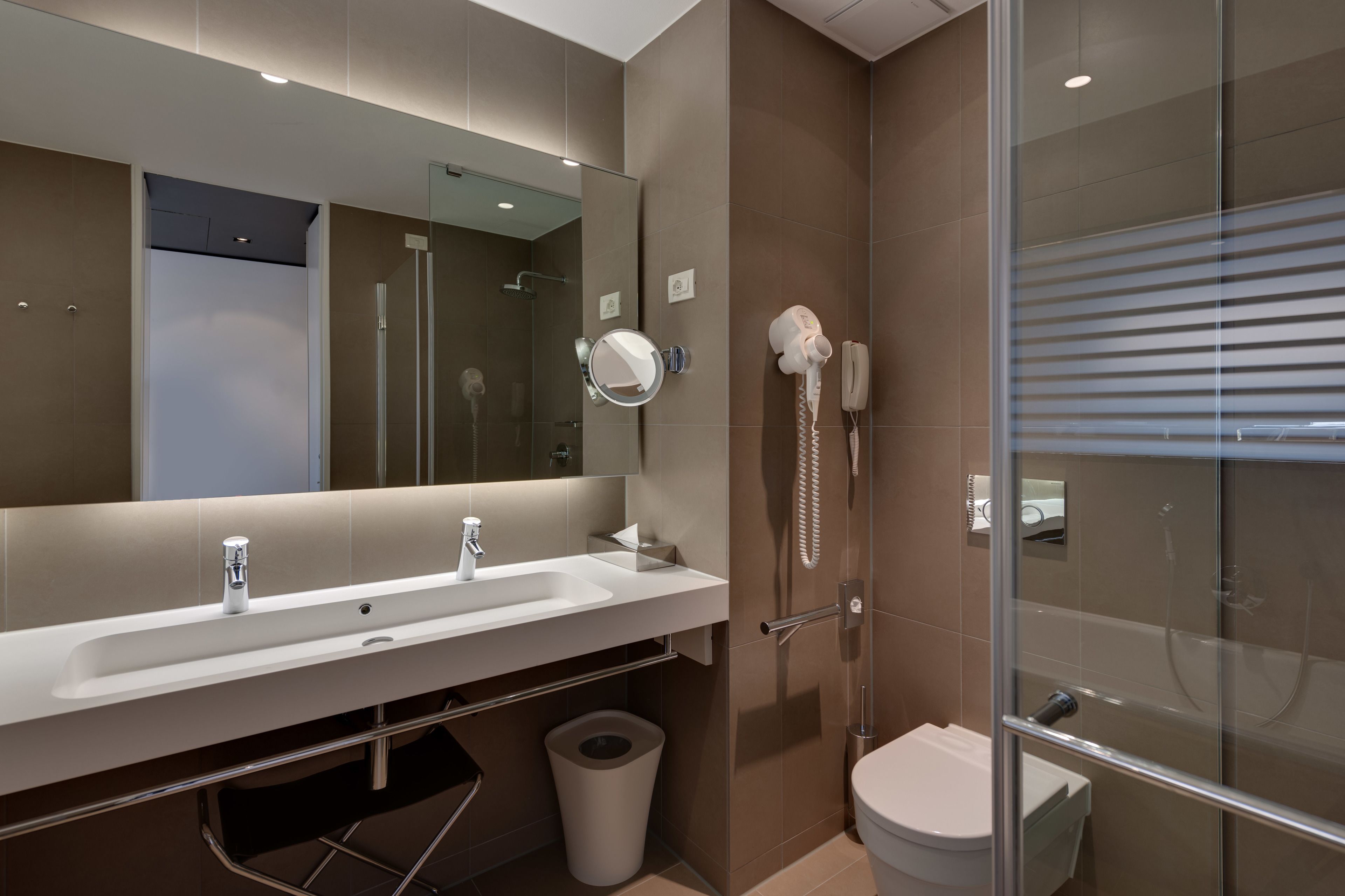 separate bathtub and shower, rainfall showerhead, designer toiletries