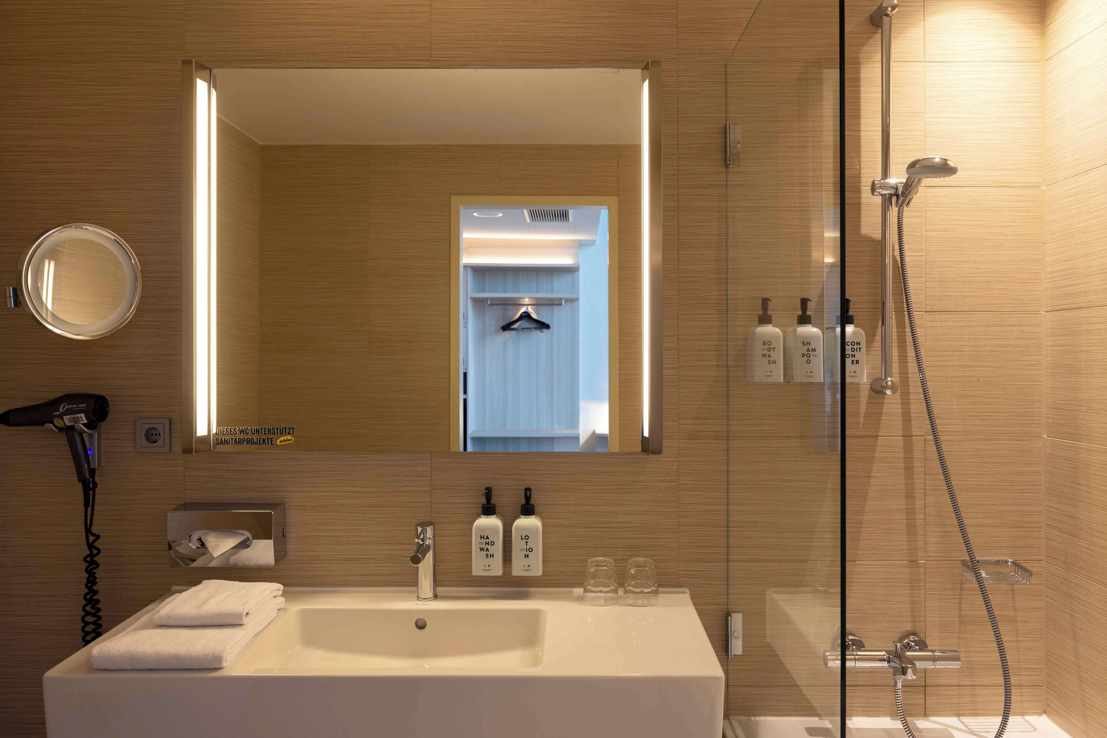 eco-friendly toiletries, hair dryer, bathrobes, towels