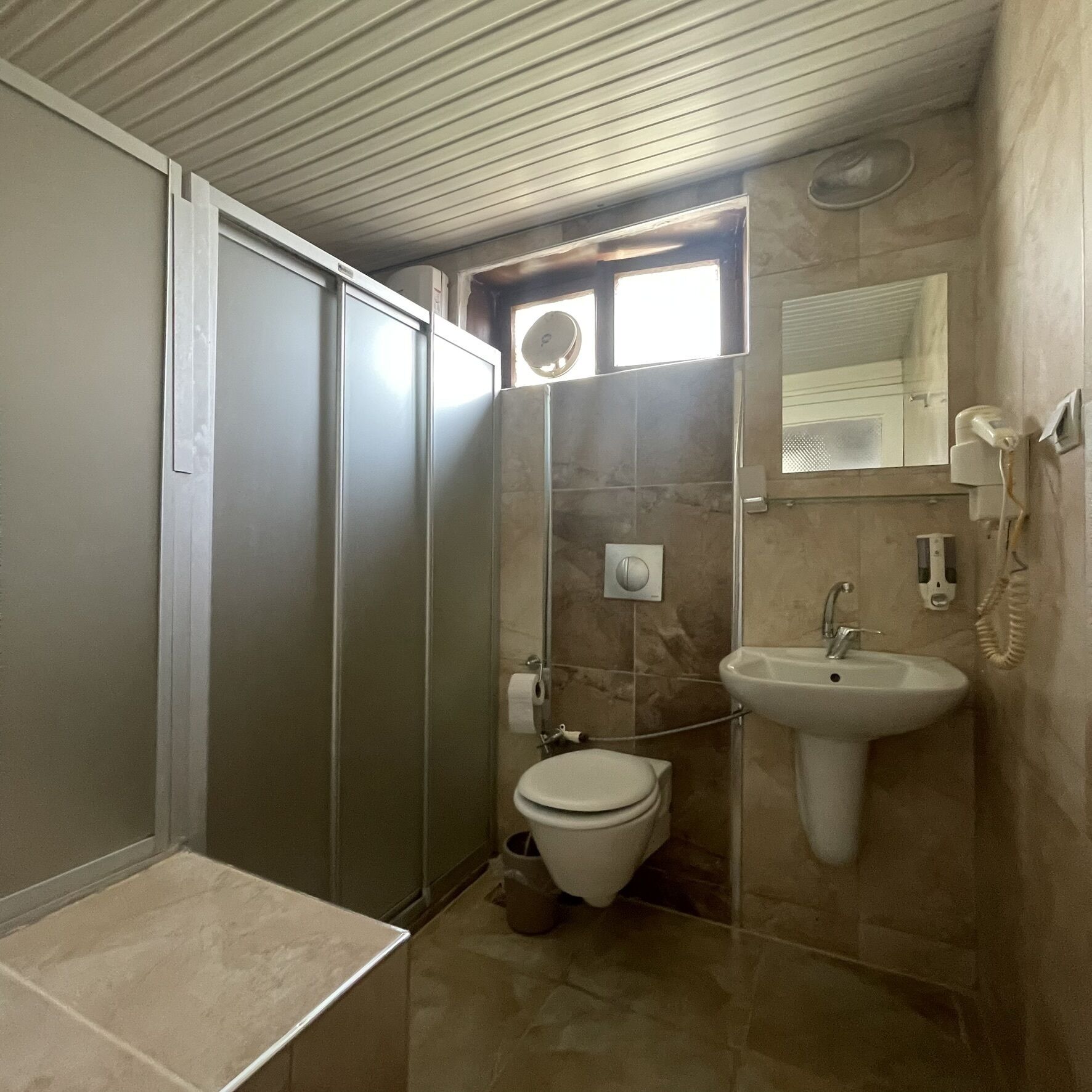 family room | bathroom | shower, free toiletries, hair dryer, slippers