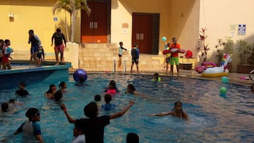 Outdoor pool, open 9:00 AM to 9:00 PM, pool umbrellas, pool loungers