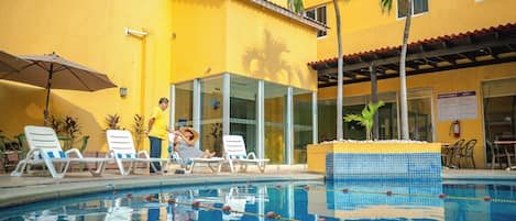 Outdoor pool, open 9:00 AM to 9:00 PM, pool umbrellas, sun loungers