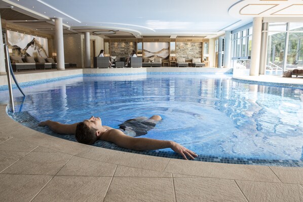 Indoor pool, outdoor pool, pool umbrellas, pool loungers