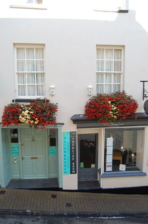 A building with two doors labeled "The Olive Branch" and "The Olive Room." - The Olive Branch (Ilfracombe)