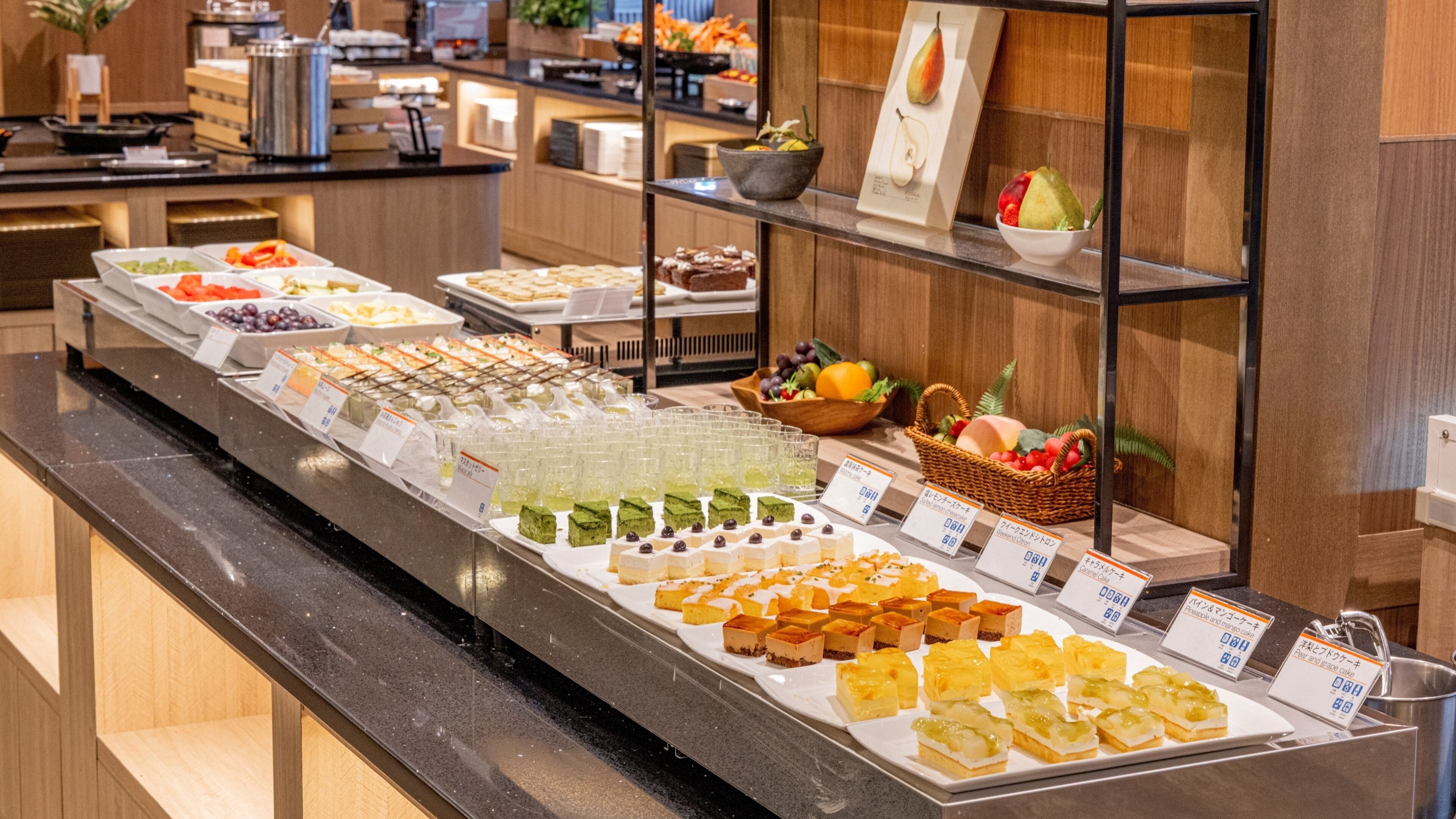 A buffet with various food items and beverages.