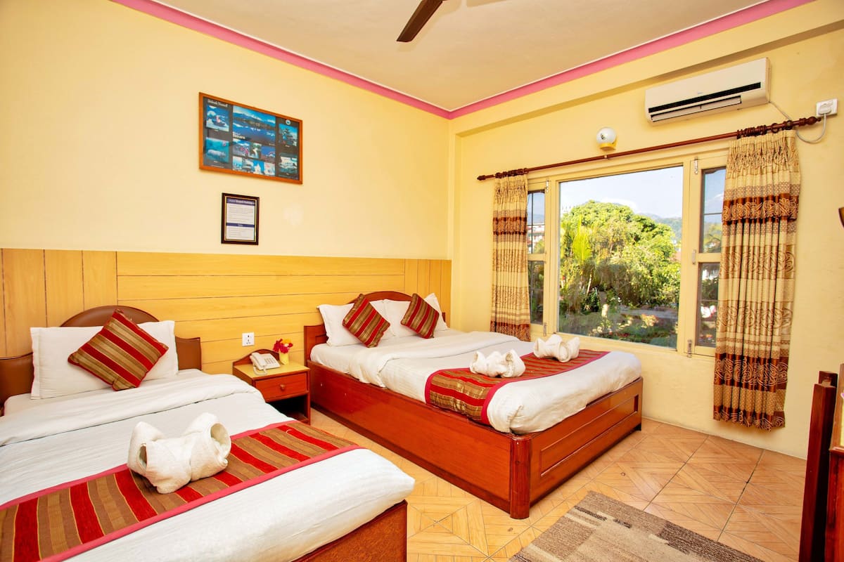 Family Triple Room, Mountain View | Premium bedding, memory-foam beds, in-room safe, individually decorated