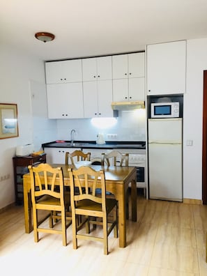 Apartment, 2 Bedrooms | Private kitchen | Fridge, microwave, stovetop, coffee/tea maker