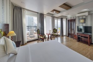 Grand Room, Balcony, Sea View | Minibar, in-room safe, desk, laptop workspace - NNT Plus Astro Hotel (Nha Trang)