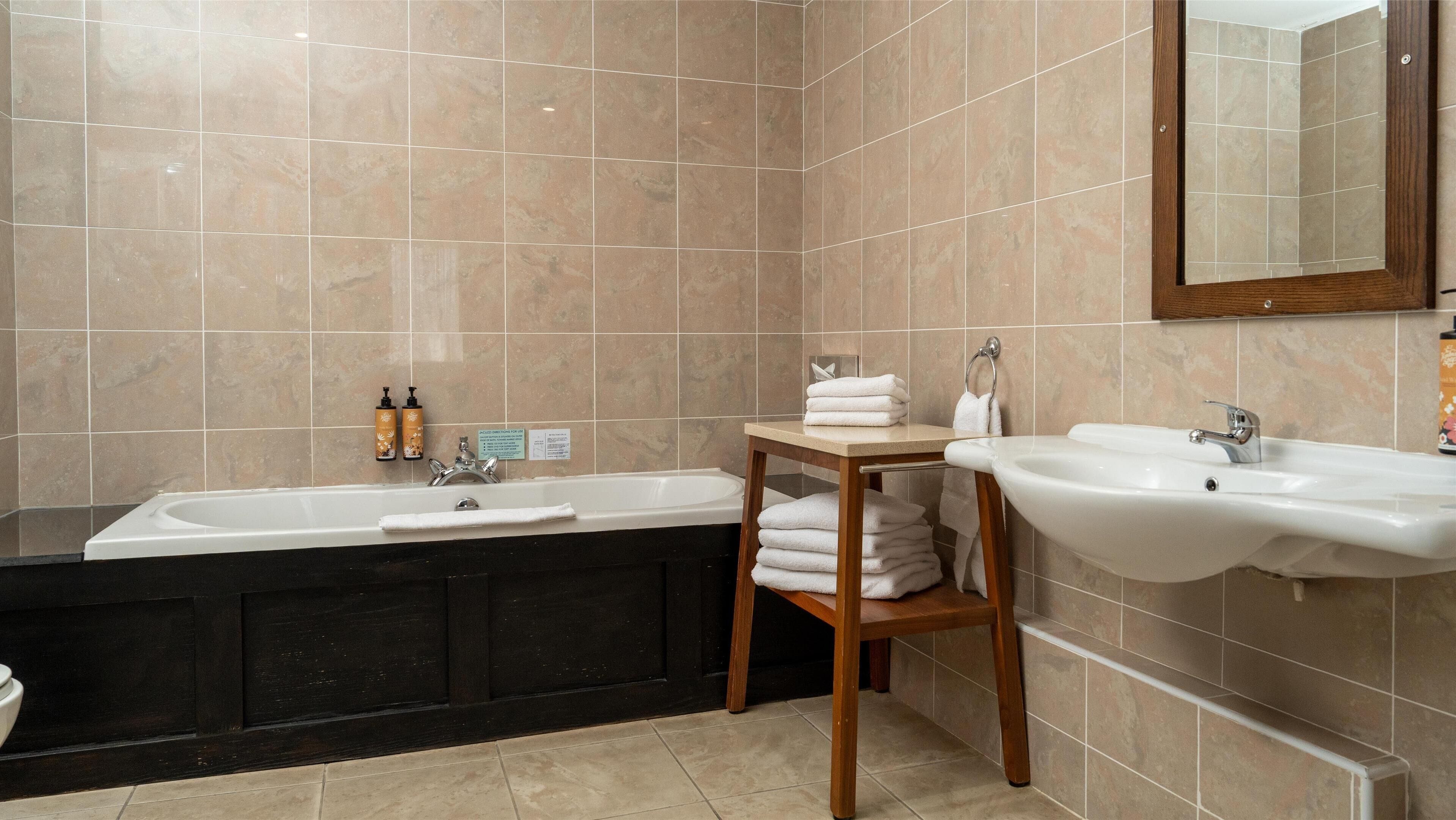 combined shower/bathtub, free toiletries, hair dryer, bathrobes