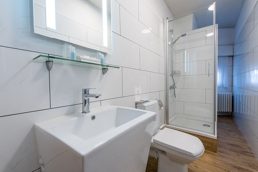 minibar, desk, blackout curtains, iron/ironing board