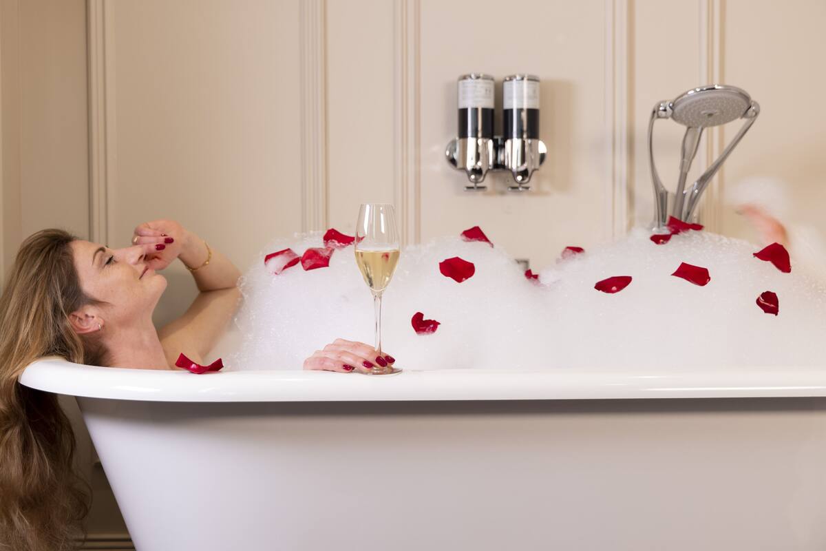 designer toiletries, hair dryer, bathrobes, slippers