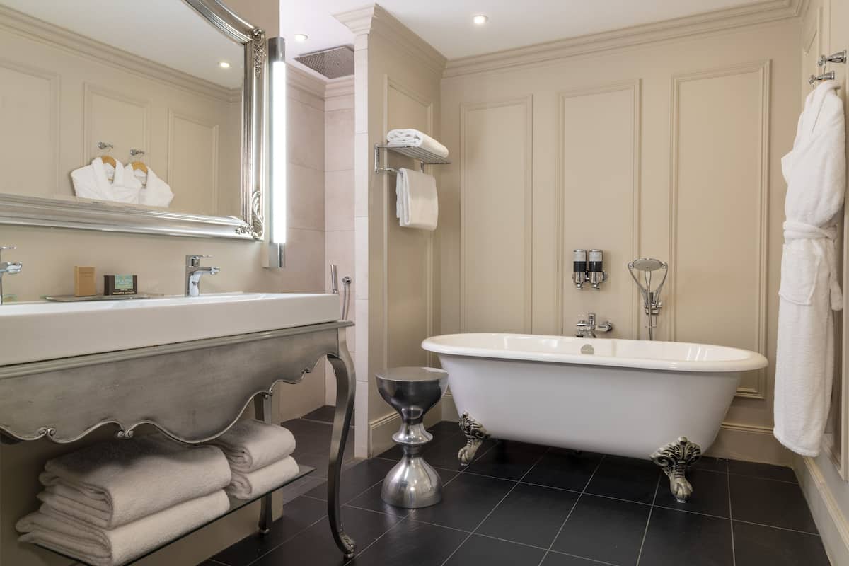 designer toiletries, hair dryer, bathrobes, slippers