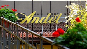 A building with a large golden sign that reads "Andel". - Andel Apartments Praha (Prague)