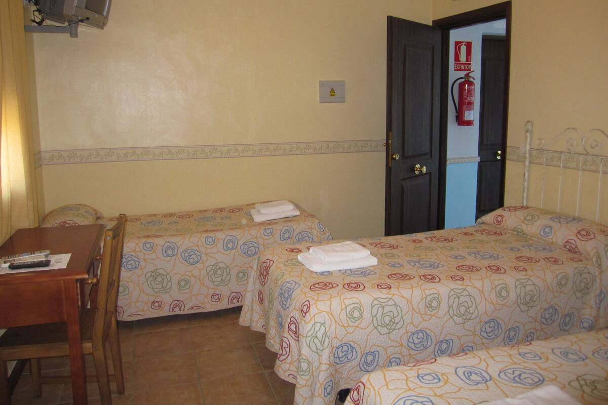Basic Triple Room, 3 Single Beds, Hill View, Courtyard Area | Desk, free WiFi