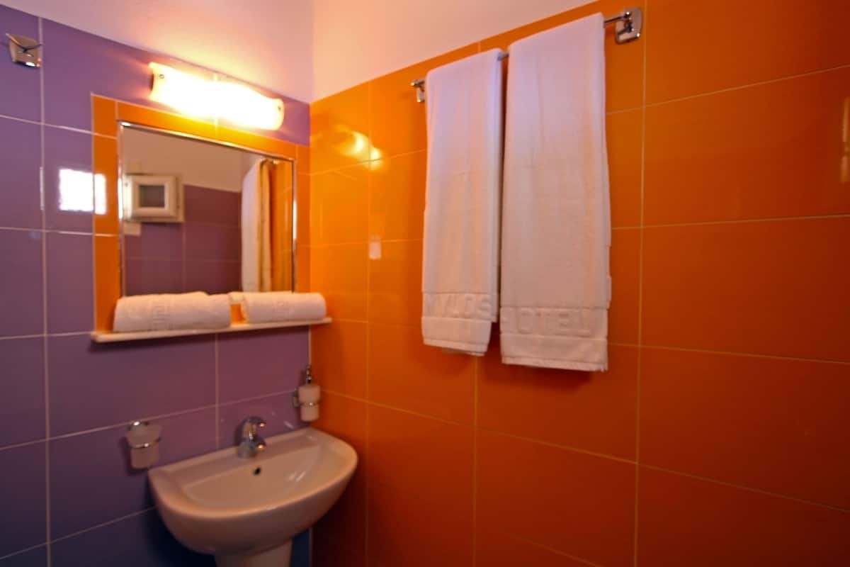 standard room | bathroom | shower, hair dryer, towels, soap