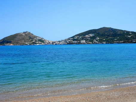 On the beach, sun loungers, beach towels. Apartments & Suites Papafotis