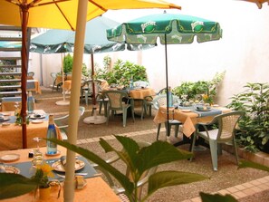 Breakfast, lunch, dinner served; al fresco dining