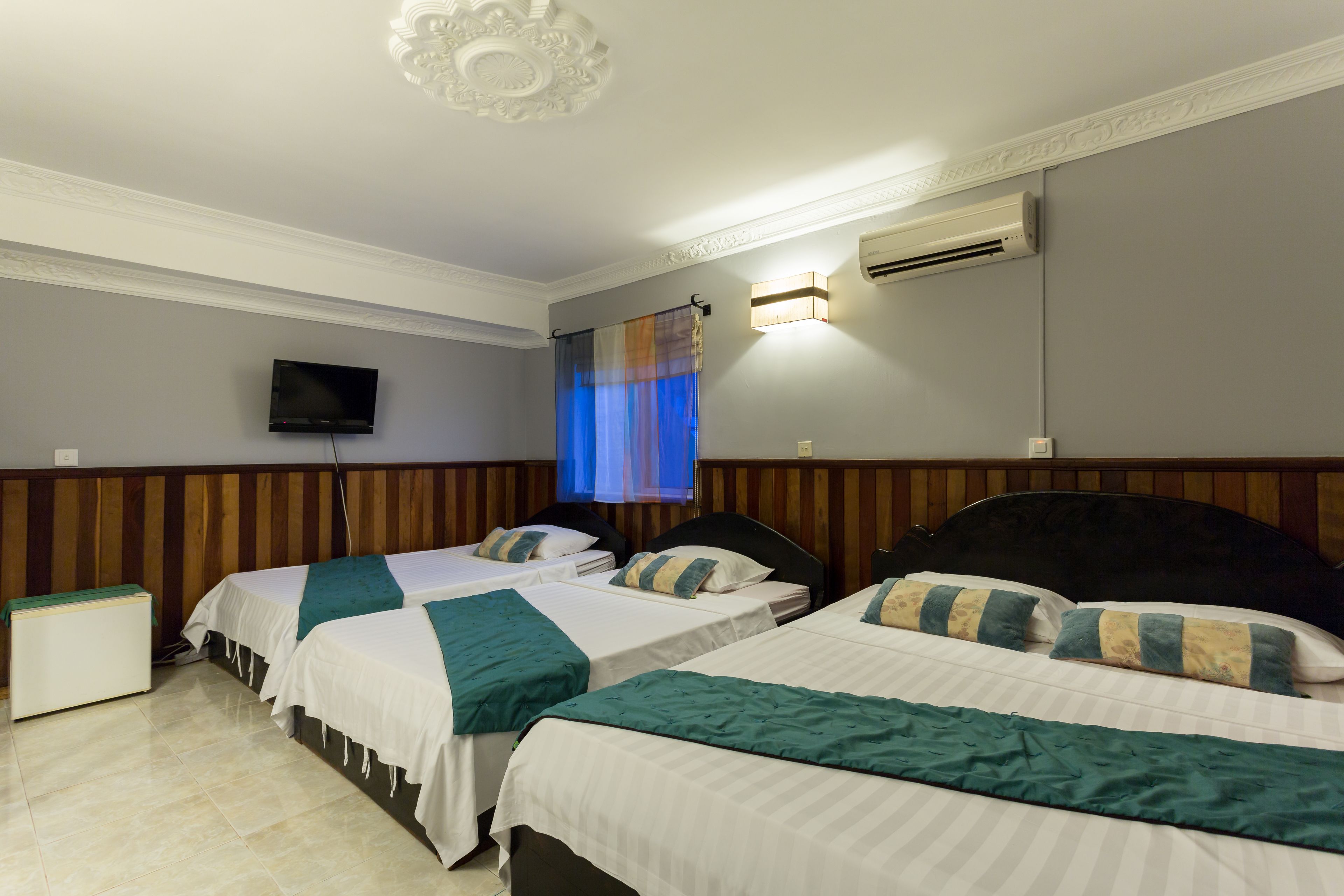 deluxe quadruple room | premium bedding, in-room safe, desk, cots/infant beds