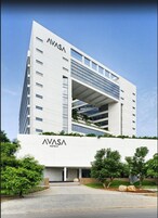 A modern AVASA hotel building with a prominent entrance and a covered outdoor area.