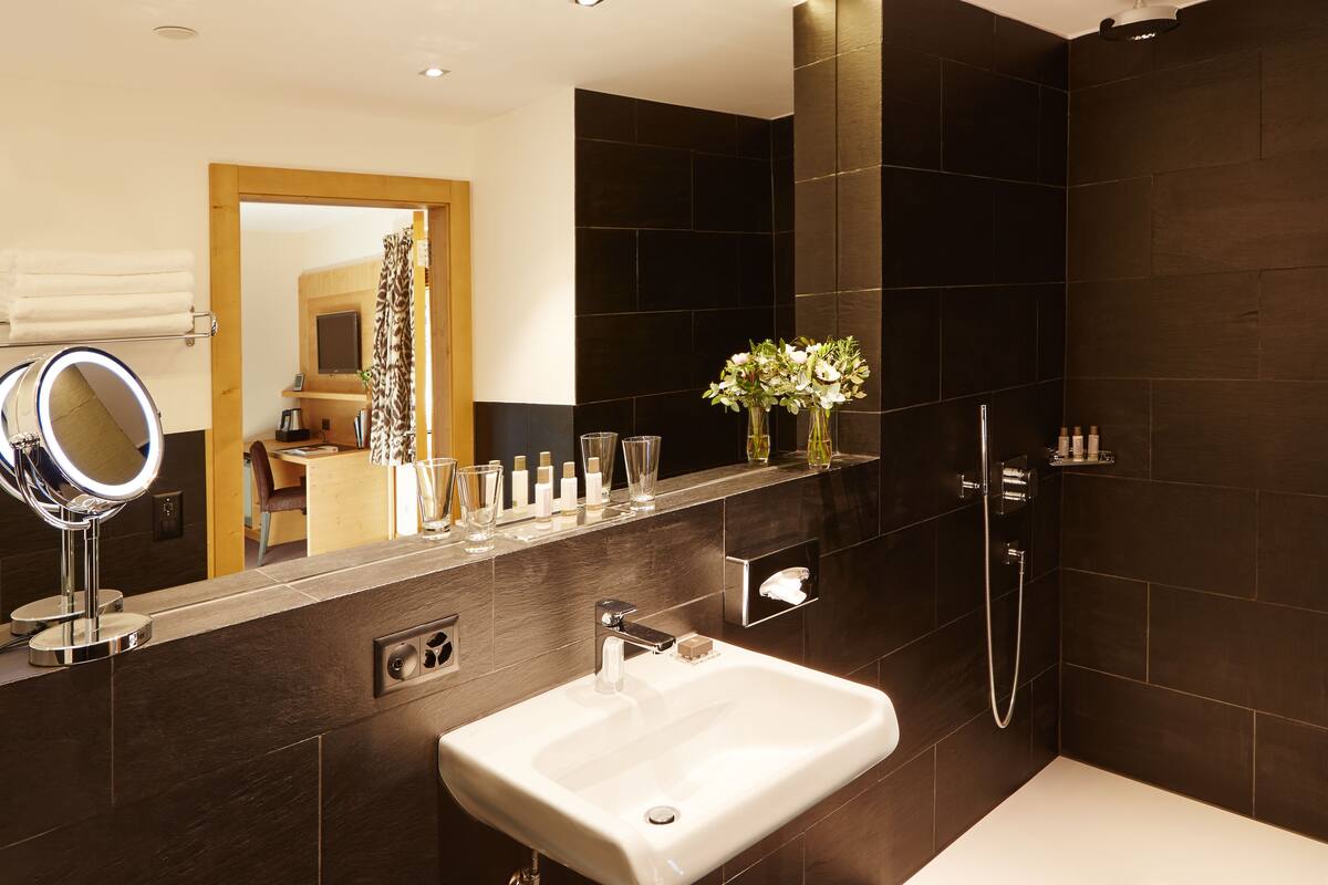 comfort room | bathroom | rainfall showerhead, free toiletries, hair dryer, bathrobes