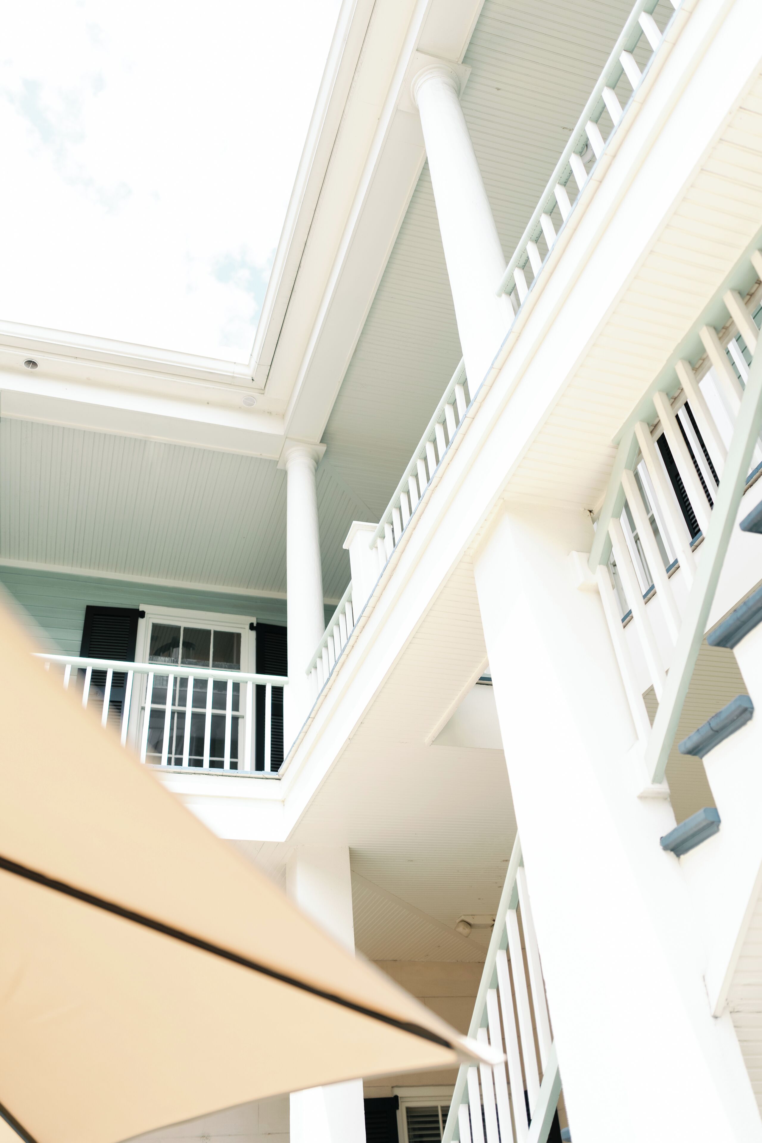 A multi-level building with balconies and a central atrium.