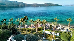 A resort named "RODRUM" with a clear view of the lake and mountains in the background. - TUI MAGIC LIFE Bodrum - Adults Only (16+) - All Inclusive (Bodrum)