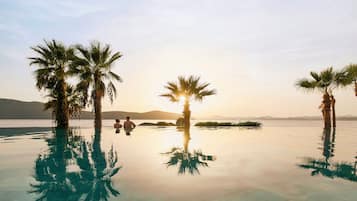 Indoor pool, seasonal outdoor pool, pool umbrellas, pool loungers