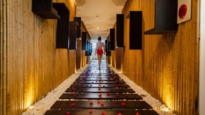 A hallway with a wooden floor and walls, leading to a room. - Muong Thanh Grand Ha Long Hotel (Bai Chay)