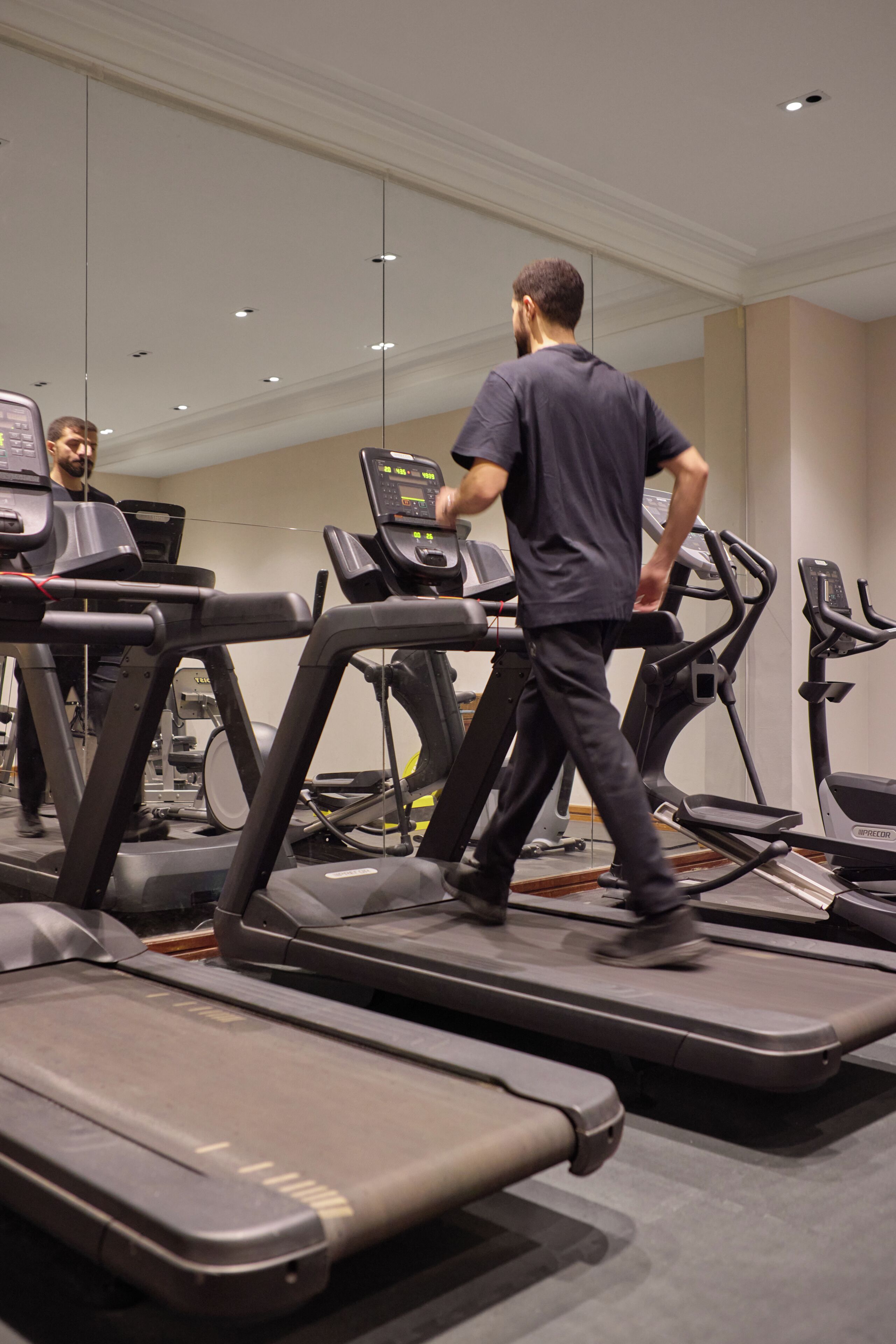 A gym with treadmills and exercise equipment.
