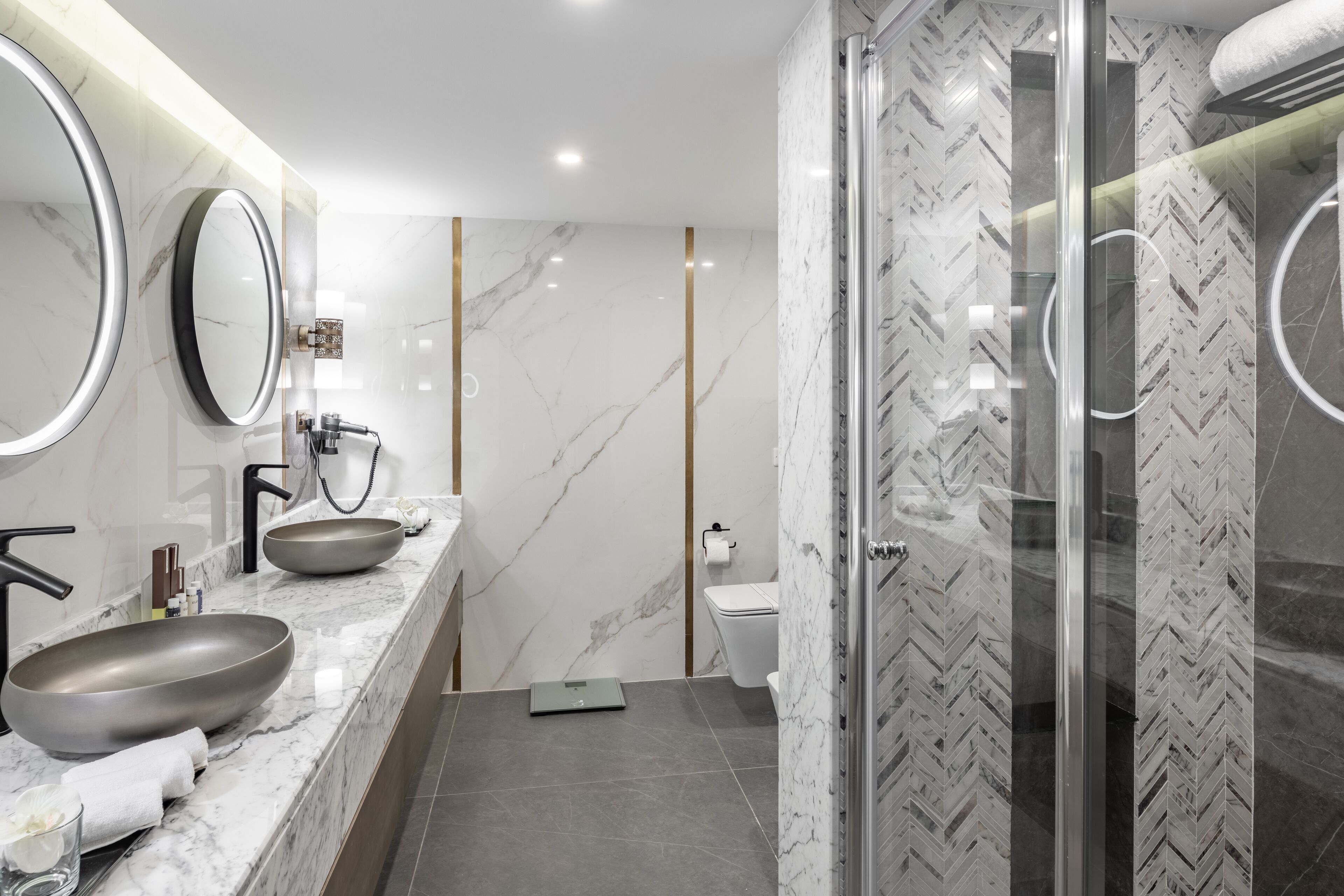 Deep-soaking bathtub, rainfall showerhead, designer toiletries