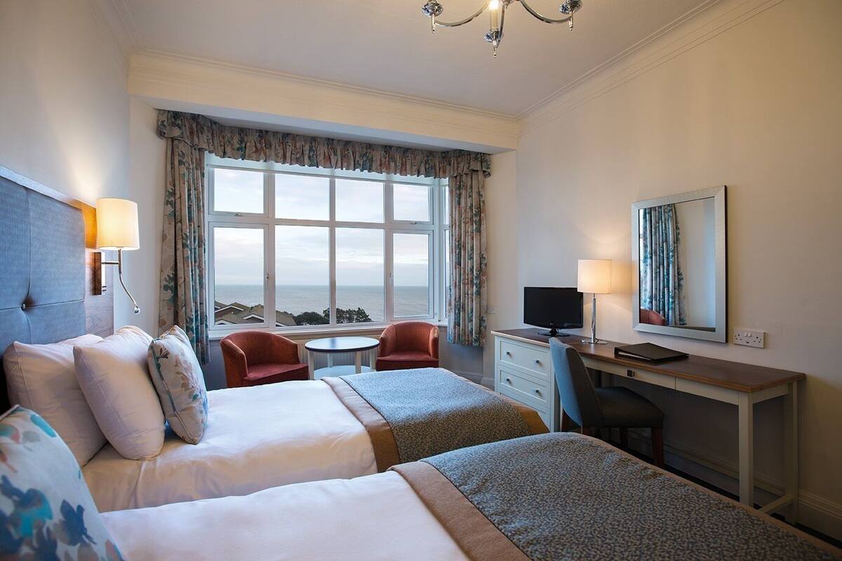 twin room, partial sea view | in-room safe, free wifi, bed sheets