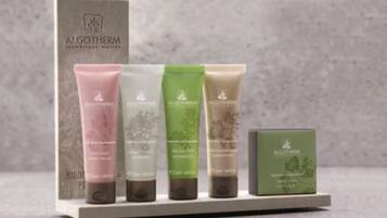 A display of skincare products from ALGOTHERM on a shelf.