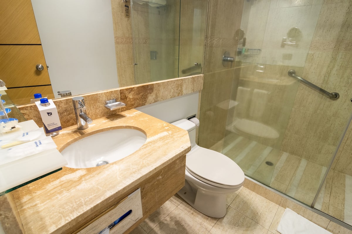 standard twin room | bathroom | shower, rainfall showerhead, designer toiletries, hair dryer