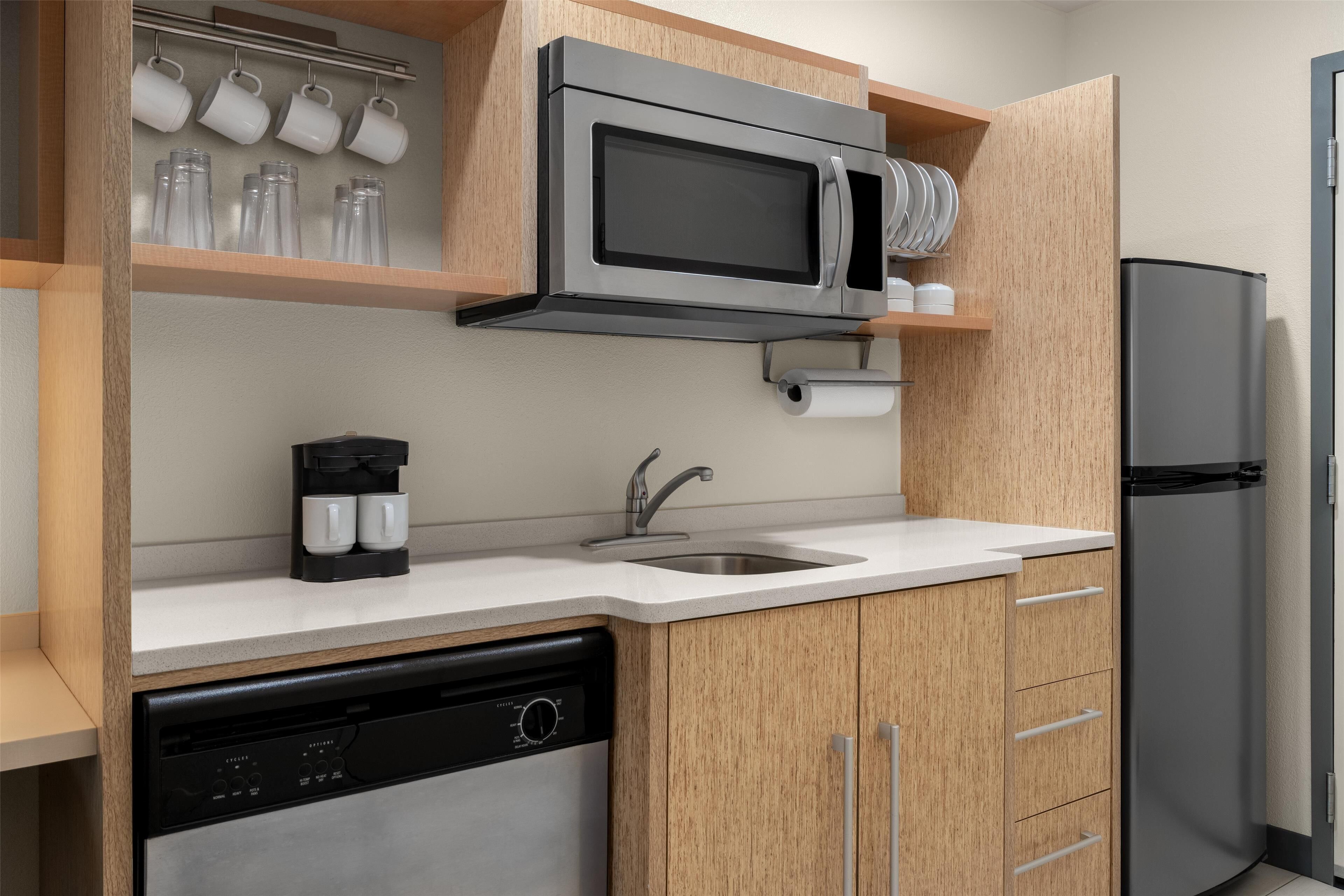 full-sized fridge, microwave, stovetop, dishwasher