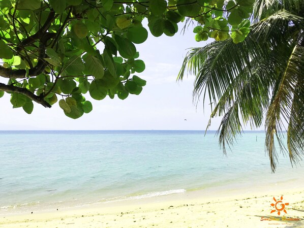 On the beach, white sand, sun loungers