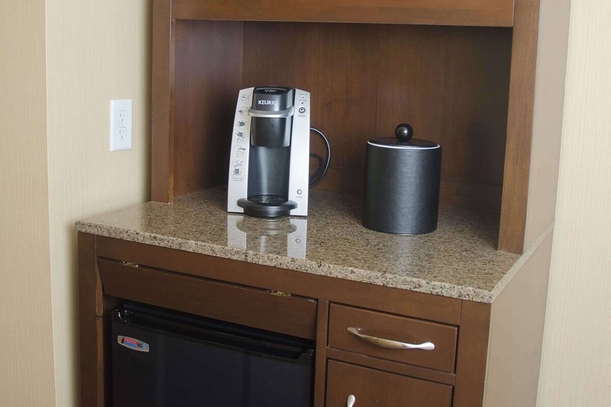 fridge, microwave, coffee/tea maker, cookware/dishes/utensils