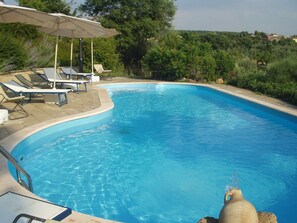 Seasonal outdoor pool, open 9:00 AM to 5:00 PM, pool umbrellas