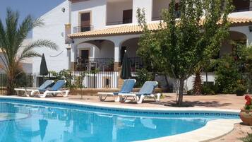 Outdoor pool, open 10:30 AM to 8:30 PM, pool umbrellas, pool loungers
