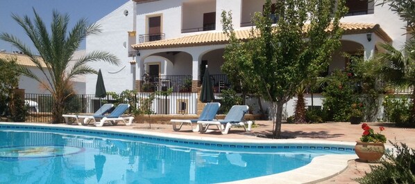 Outdoor pool, open 10:30 AM to 8:30 PM, pool umbrellas, pool loungers