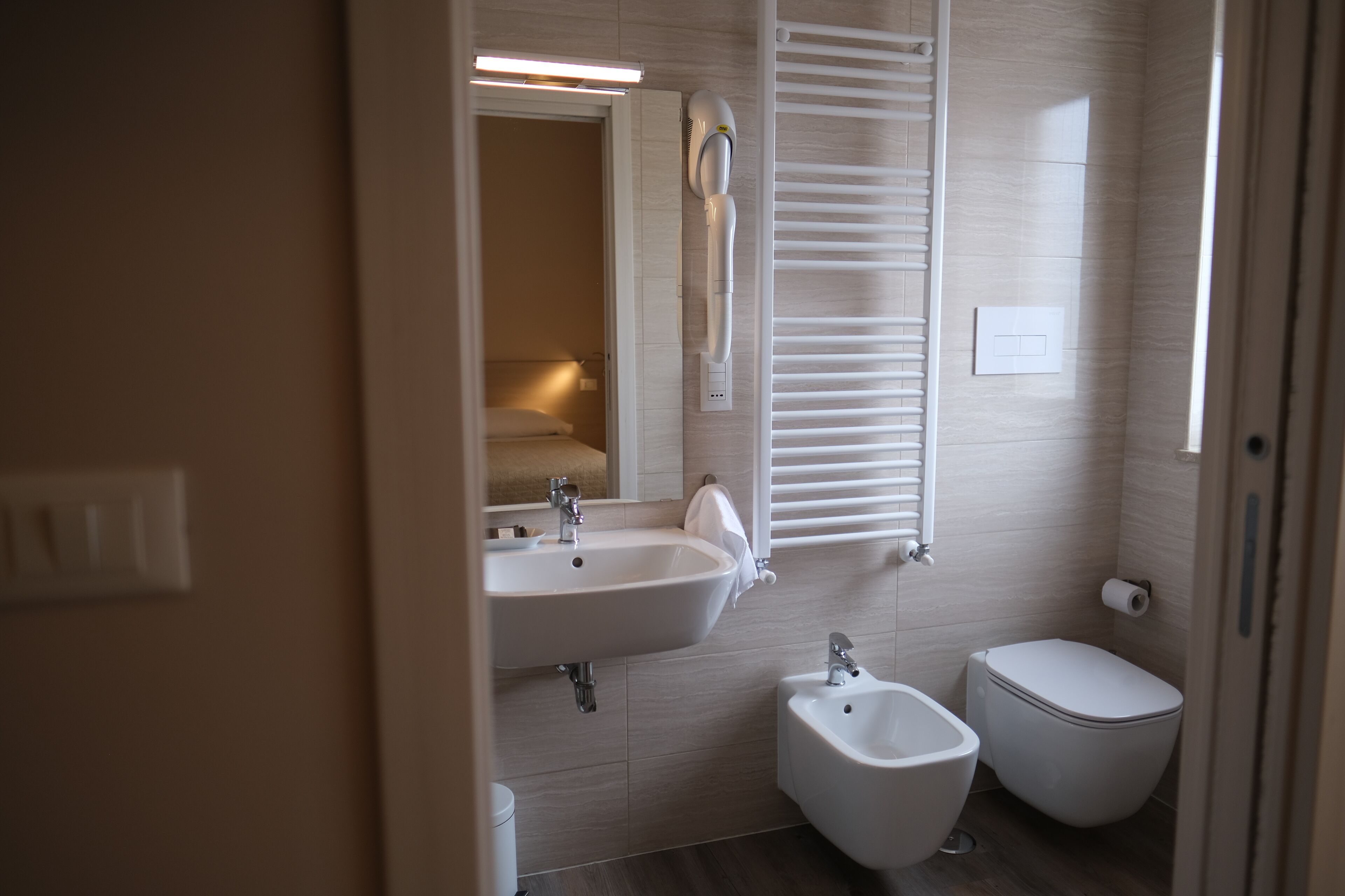 free toiletries, hair dryer, slippers, bidet