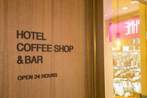 A wooden sign with "HOTEL COFFEE SHOP & BAR" and "OPEN 24 HOURS" written on it. - Just Live Inn Taipei Station (Taipei)