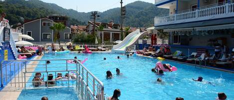 Outdoor pool, open 9 AM to 6 PM, pool umbrellas, pool loungers