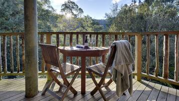 Luxury Suite, 1 King Bed, Jetted Tub, Hill View | In-room safe, desk, blackout drapes, iron/ironing board