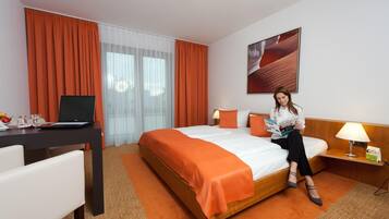 Hypo-allergenic bedding, in-room safe, desk, blackout drapes