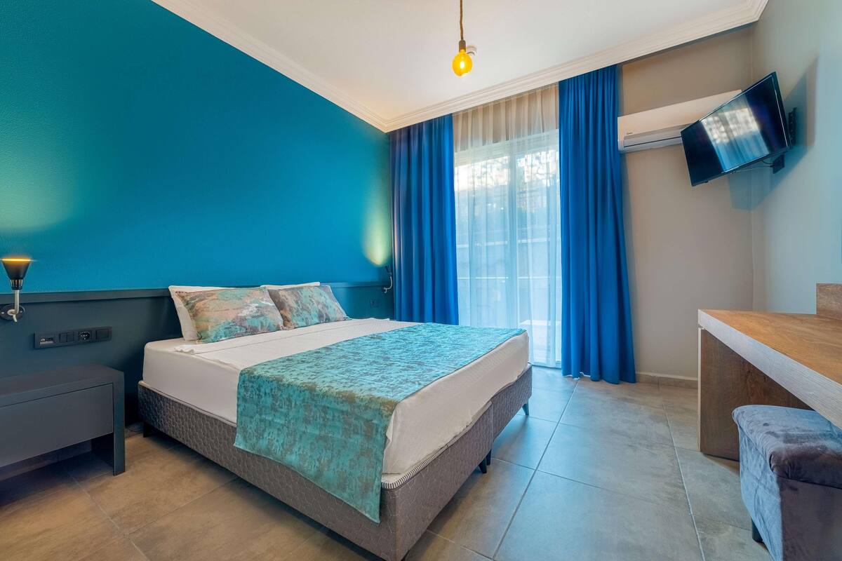 Minibar, desk, blackout drapes, iron/ironing board