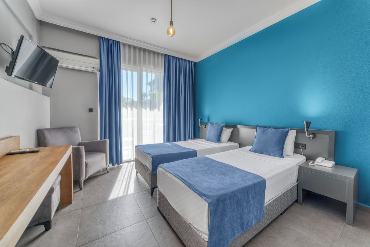 Standard Double or Twin Room, 1 Bedroom | Minibar, desk, blackout drapes, iron/ironing board