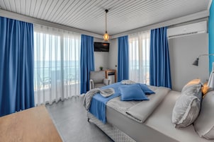 Superior Room, Sea View | Minibar, desk, blackout drapes, iron/ironing board