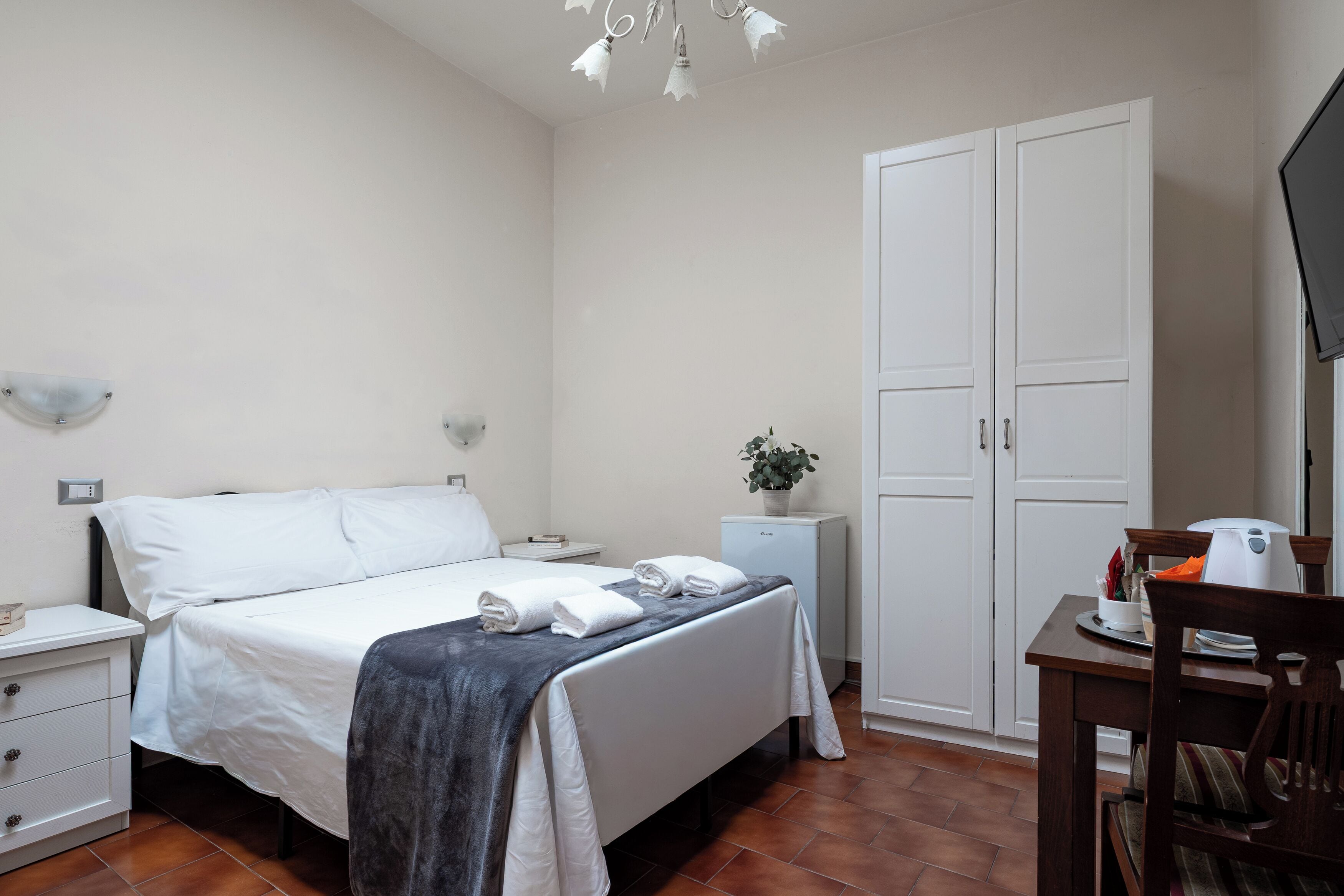 Basic Double Room, Private Bathroom (external) | Minibar, in-room safe, individually furnished, iron/ironing board