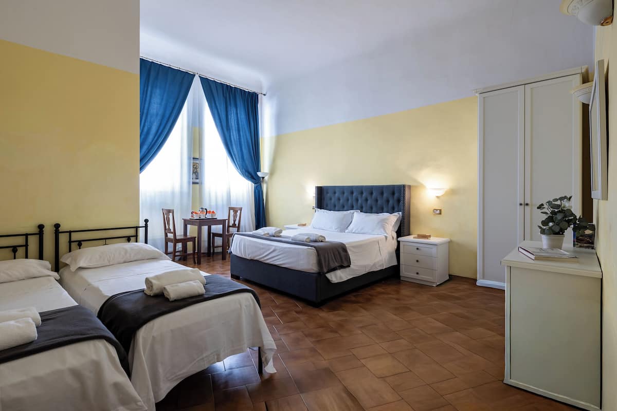 Family Room | Minibar, in-room safe, individually furnished, iron/ironing board